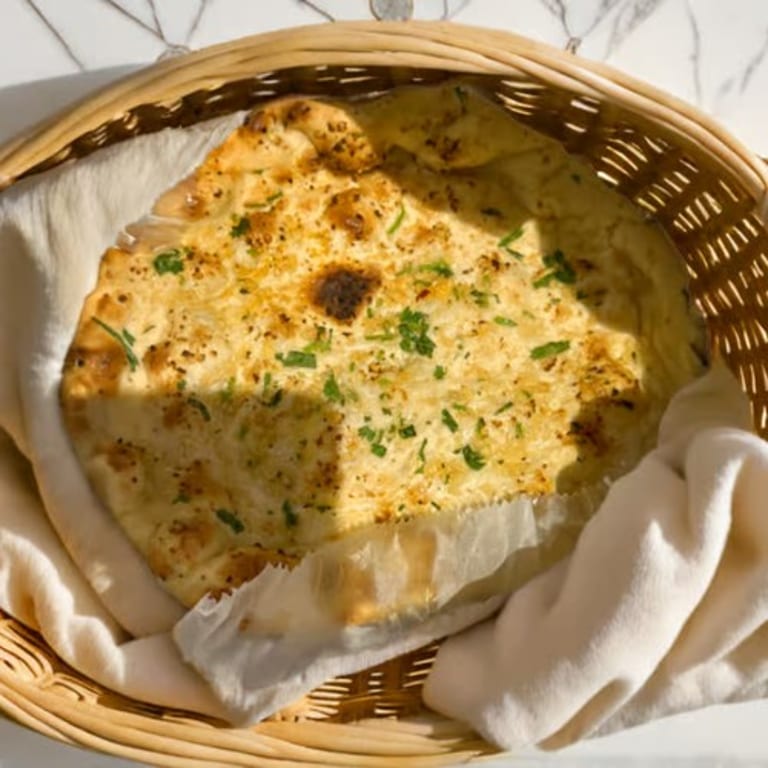 Freshly Baked Naan: A Flavorful Addition